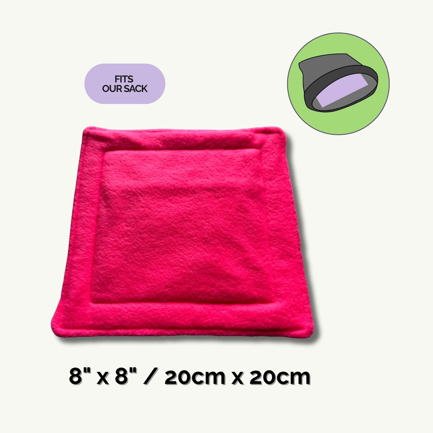 A wickedly vibrant pink, square pee pad (8 x 8 in/20 x 20 cm) lays temptingly—ready for your little bat or beastie to lounge in gothic glam style. In a moonlit circular inset, a shadowy black and purple cuddle sack sits enchantingly beside bold lettering: “FITS OUR SACK.” This sorcerous combo whisks away cleaning woes, so every fancy familiar can haunt their lair in comfort and charm.