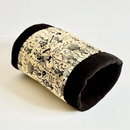The Tombstone Tango Fleece Tunnel beckons your little critters to waltz into a gothic-glam hideaway—black velvet-inspired ends frame a crypt-chic beige center, all adorned with playful illustrations of woodland creatures and enchanted flora. This spooky-cute tunnel is perfect for guinea pig midnight zoomies, moonlit burrows, and snugglings straight from a storybook.