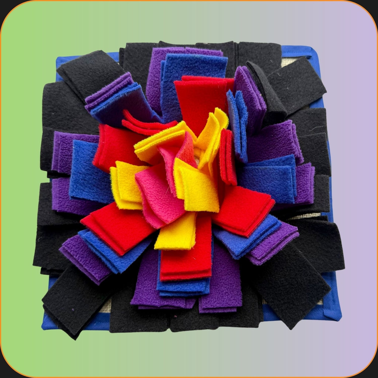 A whimsically spooky flower brooch crafted from layered fabric in black, purple, and jewel tones—perfect for your tiny familiar—resting against a mystical green-to-purple gradient backdrop.