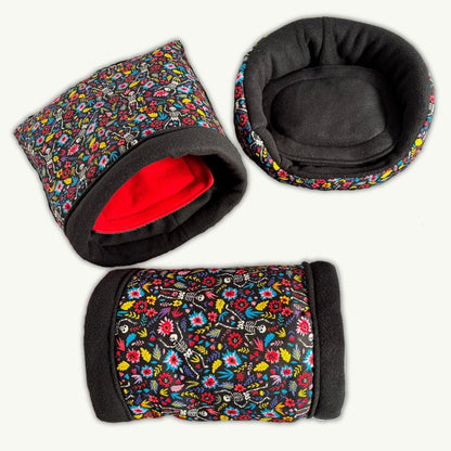 Blooms & Bones Bundle: three bewitching pet beds—floral prints, black fleece, and a red-lined snuggle sack—for cozy gothic cuddles!.