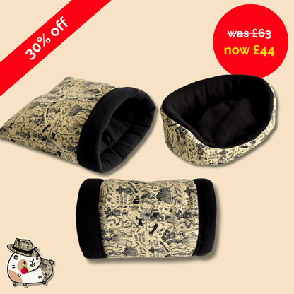 The Tombstone Tango Set haunts in black and beige adventure patterns; red sale tag, spooky-cute safari cat greets from the corner.