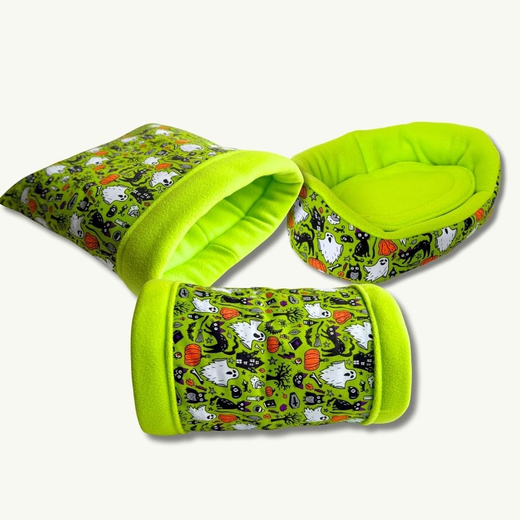 Gothic-glam Trickster’s Treats: neon green pet beds with playful ghosts, pumpkins, and bats—spooky-cozy for pampered piggies!.
