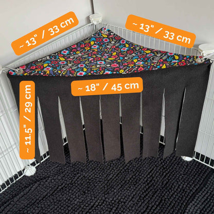 Blooms & Bones Corner Fleece Forest: gothic patchwork triangles, luxe 18” fringe drapes haunt any cage corner into a plush piggy lair.