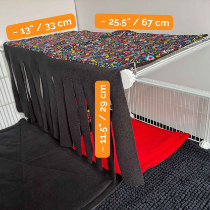 A gothic-glam Fleece Forest lair with shadowy black fringe, crimson drapes, and plush black mat—perfect for pampered piggies.