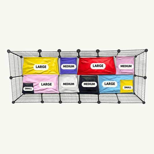 A bewitching wire basket cradles twelve enchanting pouches—five large, four medium, and three small—each one draped in vibrant potion hues and adorned with gothic-chic labels. Nestled alongside are Frightful Fiesta bedding, bursting with carnival colors and spectral skulls, and Blooms & Bones matching pee pads that blend dark florals with playful bone motifs. This spooky-cute setup invites small pet lovers to enjoy stress-free cleaning with a dash of gothic glamour!.