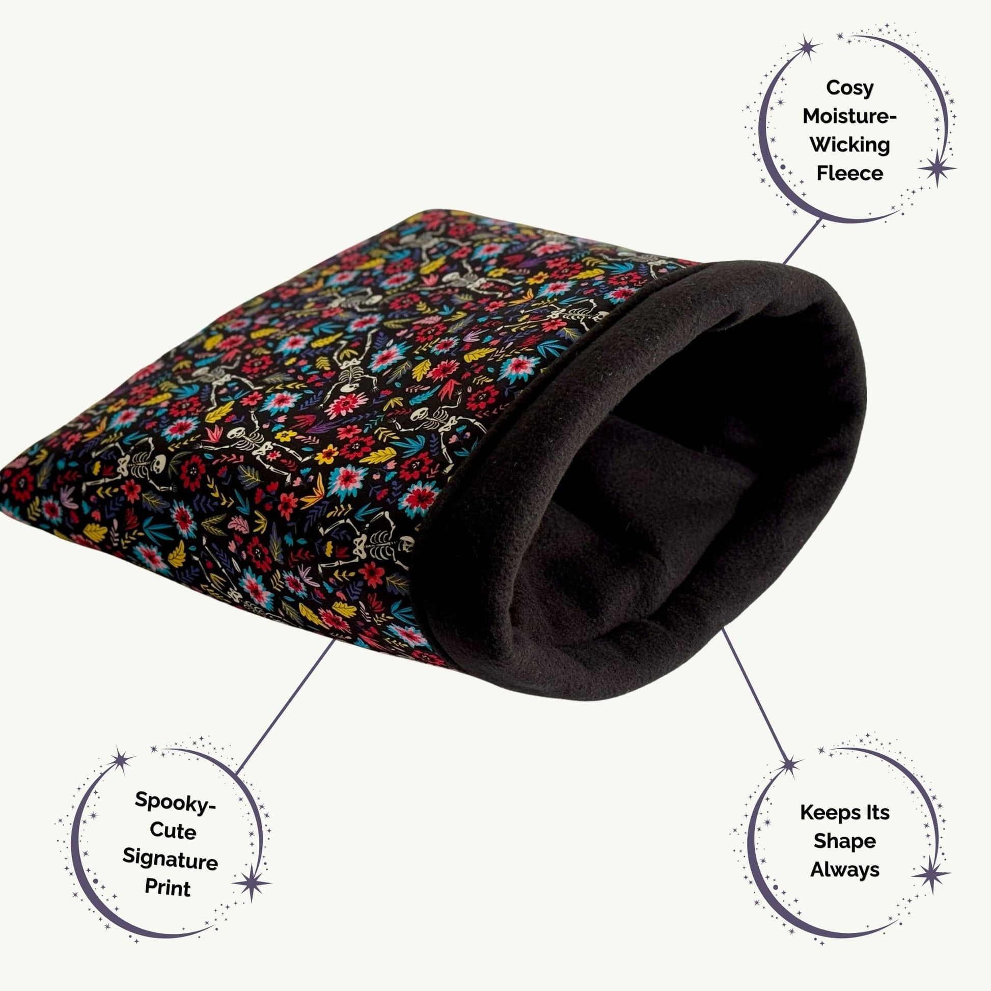 The Blooms & Bones Snuggle Sack enchants with gothic-glam flair—a plush pet tunnel draped in whimsical blooms, dainty skulls, and moonlit roses. Crafted in misty-soft, moisture-wicking fleece with a bewitchingly bold lining, its snug shape cocoons your guinea pig or small friend in cozy mysterious comfort—perfect for midnight snuggles and daytime lounging.