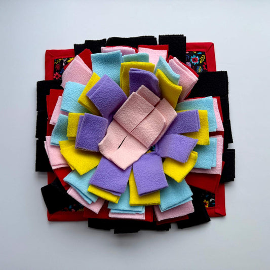 Blooms & Bones Snuffle Mat: pastel petals haunt a black and crimson base, creating an enchanting foraging quest for your piggy.