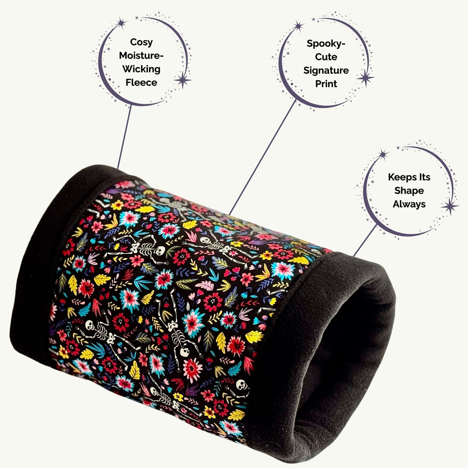 The Blooms & Bones Fleece Tunnel enchants with its midnight-black trim and velvety, moisture-wicking lining—perfect for tiny paws seeking comfort. Adorned in a whimsical print of dancing floral skeletons, this tunnel keeps its ghoulishly-glam shape, inviting small pets to burrow in spooky-cute style. An enchanting hideaway from the Blooms & Bones collection, crafted just for your beloved companion.