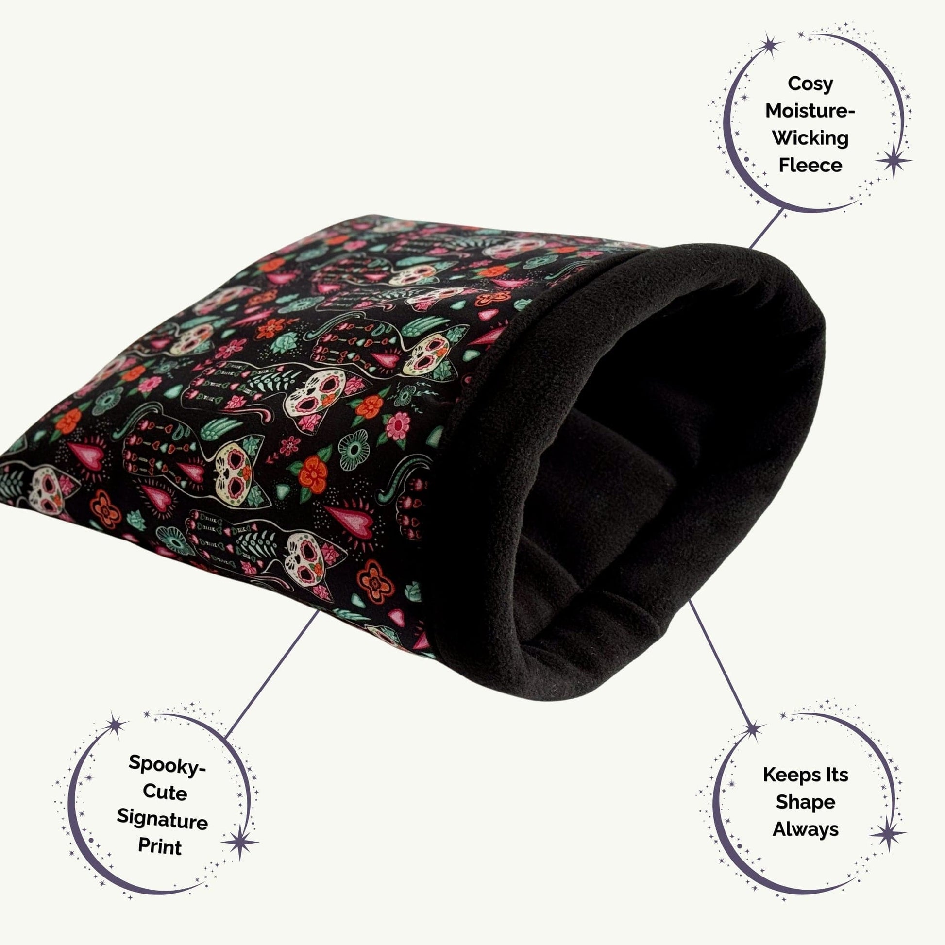 The Curious Catrina Snuggle Sack is a bewitchingly cozy fleece tunnel for guinea pigs, adorned with a gothic-glam print of playful skulls and charming floral flourishes. This snug haven features moisture-wicking black fleece lining and a shape-holding silhouette—perfect for cloaking your little familiar in spooky-cute comfort as they burrow or nap atop their favorite pee pad.