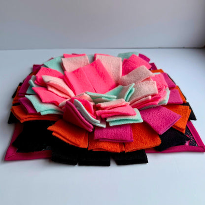 The Curious Catrina Snuffle Mat blooms with gothic-glam petals—pink, mint, peach, orange, and black—haunting treat time with delight.
