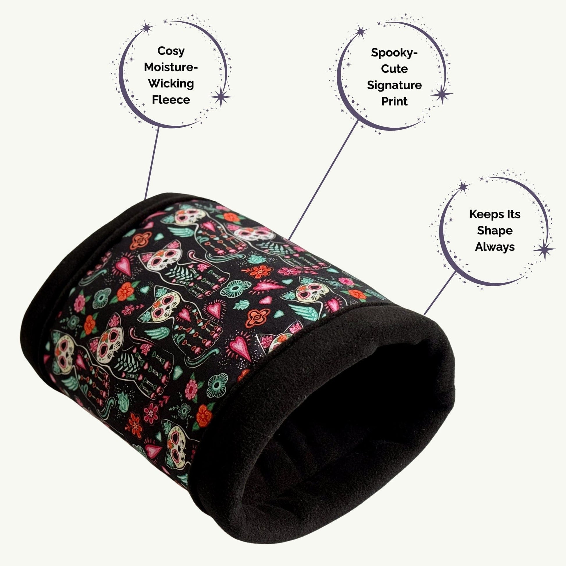 The Curious Catrina Fleece Tunnel enchants with a bewitching print of sugar skull kitties, their bright eyes ringed in gothic pastels and crowned by vivid, whimsical blossoms. Crafted from moisture-wicking fleece, this plush tunnel keeps its ghostly-cute shape—creating the perfect haunted hideaway for your guinea pigs or small pets to snuggle in style.