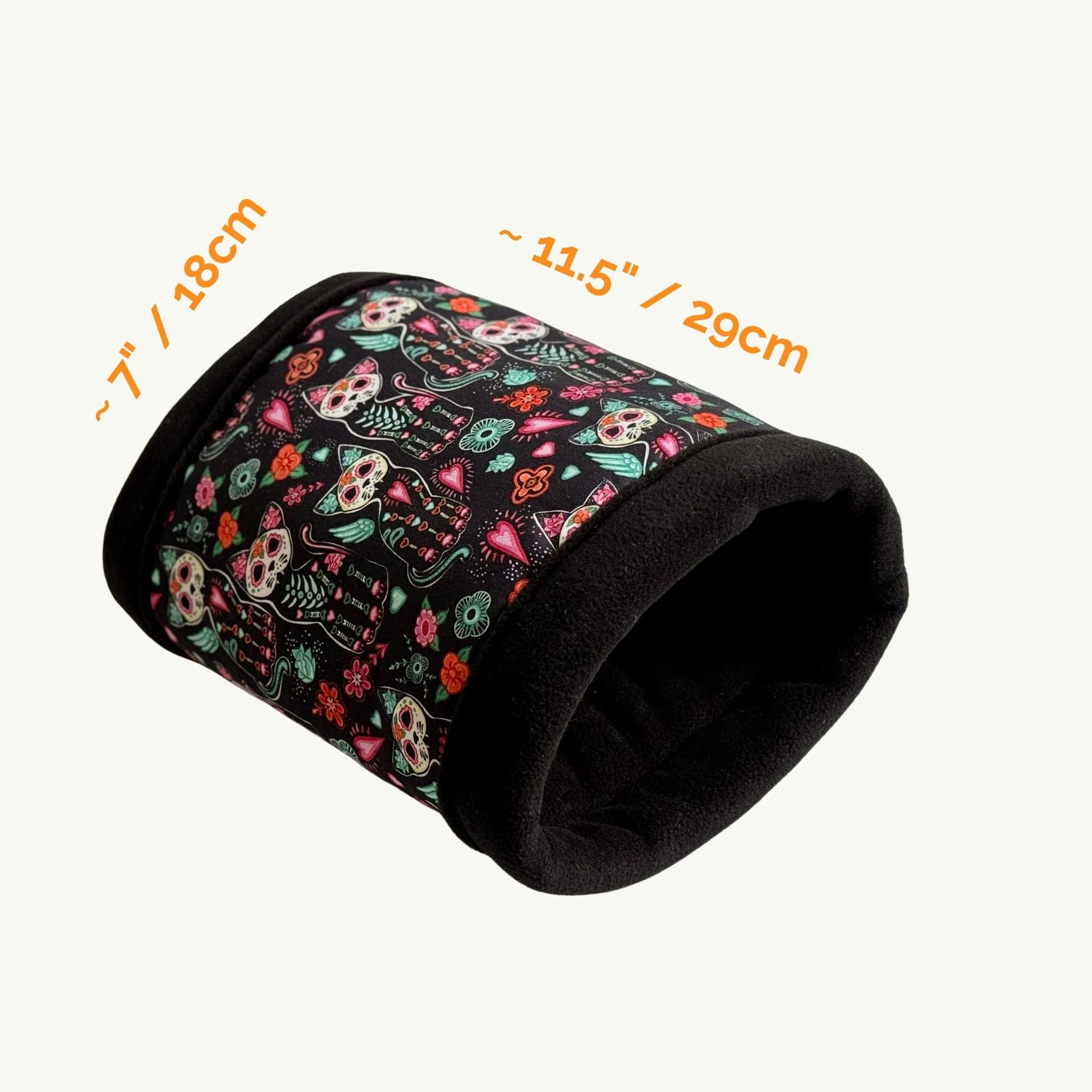 Enchant your guinea pig’s lair with the Curious Catrina Fleece Tunnel—a goth-glam hideaway draped in midnight-soft fleece. Adorned with whimsical sugar skull cats and dreamy florals in jewel tones, this cozy tunnel beckons little familiars to burrow inside for a spectral snooze. Measures approximately 7 inches (18 cm) wide by 11.5 inches (29 cm) long—perfect for petite spirits seeking stylish comfort.