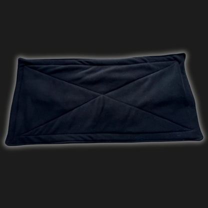 Enchant your pet’s lair with our Modular Fleece Liner & Pee Pad in midnight black—soft, plush padding stitched with gothic X marks, like secret runes woven on a velvety spell book. Shown against a moody charcoal background, this waterproof wonder is reusable and bewitchingly cozy—perfect as a mystic-cute cage liner or potty pad for your small familiars.