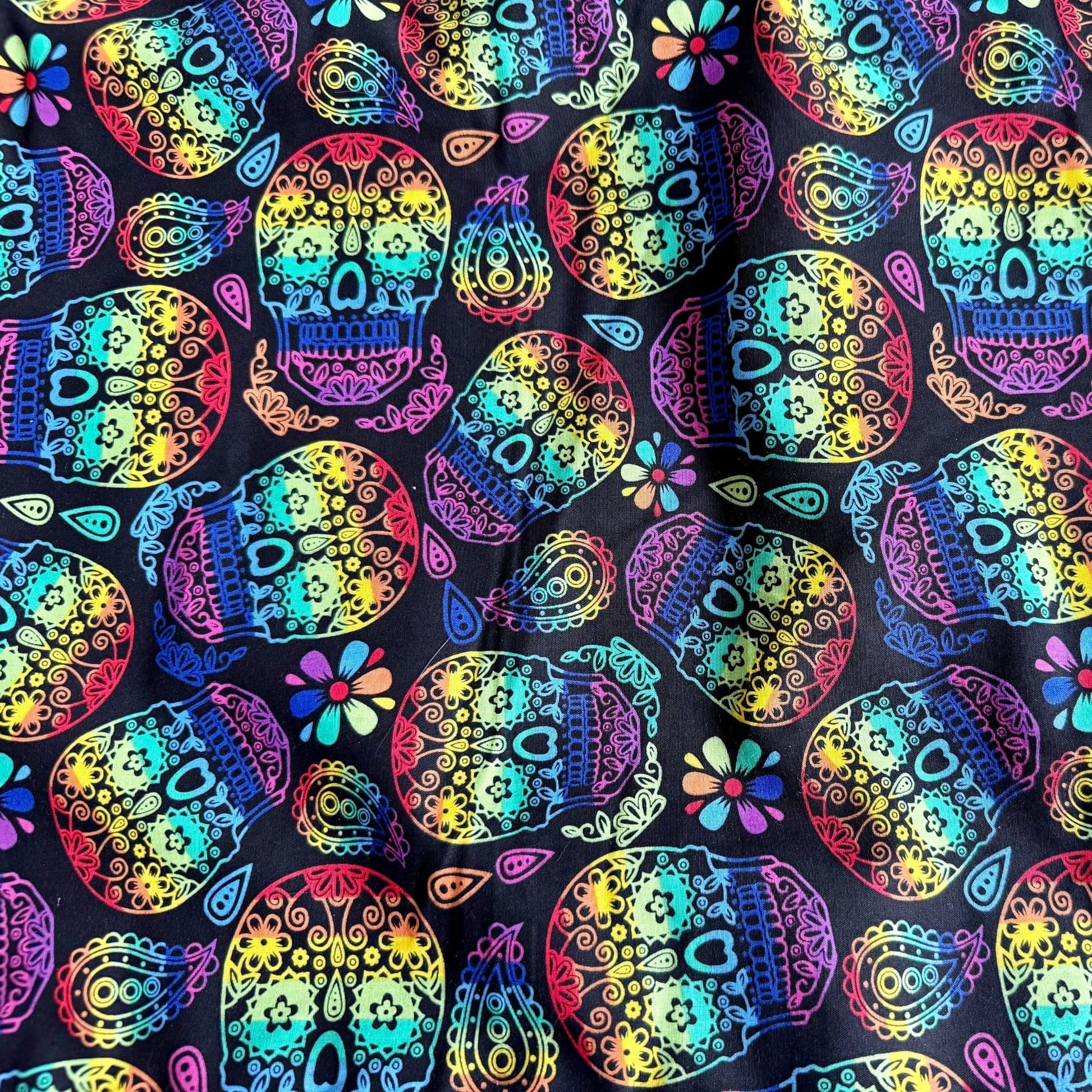 The Frightful Fiesta Snuggle Sack enchants with vivid sugar skulls and ghostly blooms, swirled together in a Day of the Dead-inspired dance of colors. Lined in midnight-black fleece for cozy burrowing, this gothic-glam hideaway invites your small pet to snuggle deep beneath a spell of spooky-cute comfort—perfect for guinea pigs who dream of both ghoulish glamour and cuddly warmth.