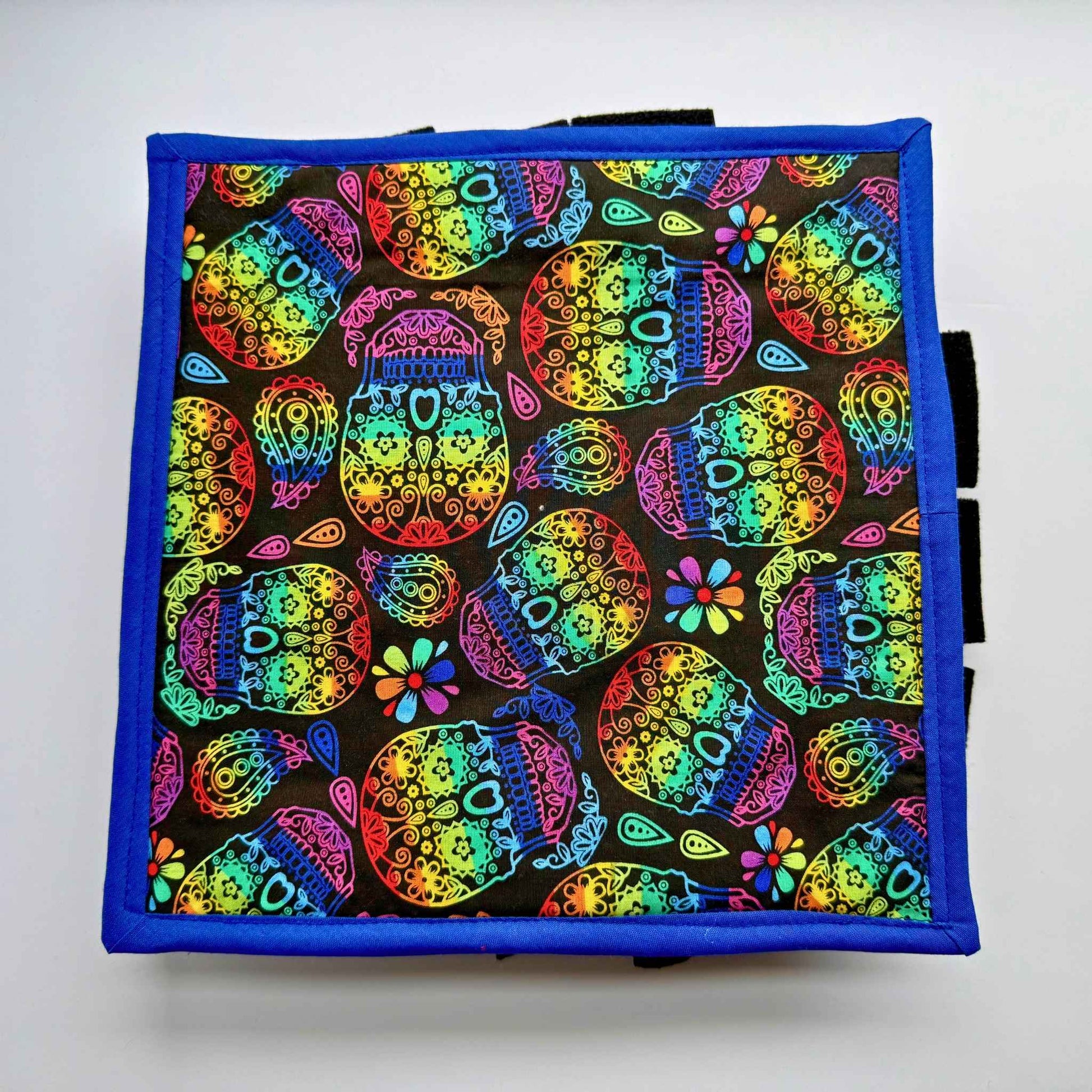Enchant treat time with the Frightful Fiesta Snuffle Mat—midnight black, neon blooms, and playful sugar skulls framed in cobalt blue!.
