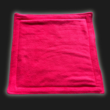 Bewitch your little beastie’s lair with our Modular Fleece Liner & Pee Pad in electrifying neon pink—its plush rectangular form edged with enchanted stitching rests atop a midnight-black stage. Soft, washable, and utterly spellbinding, this cozy pad is perfect for gothic-glam guinea pigs and charming critters alike!.