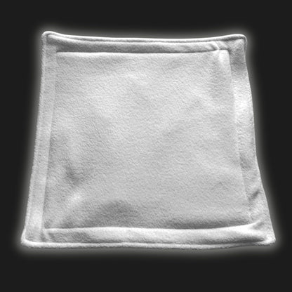 Spooky-cute alt text: Enchant your little familiar’s lair with our Moonlit Mist Modular Fleece Liner & Pee Pad—a bewitchingly soft, ghostly white square with elegantly rounded corners. This enchanted, plush pad is luxuriously cozy under paw and conjures a waterproof barrier to keep their gothic-chic habitat clean and dry. Perfect for cavy covens, hamster hideaways, or any petite creature seeking spectral style and dreamy comfort.