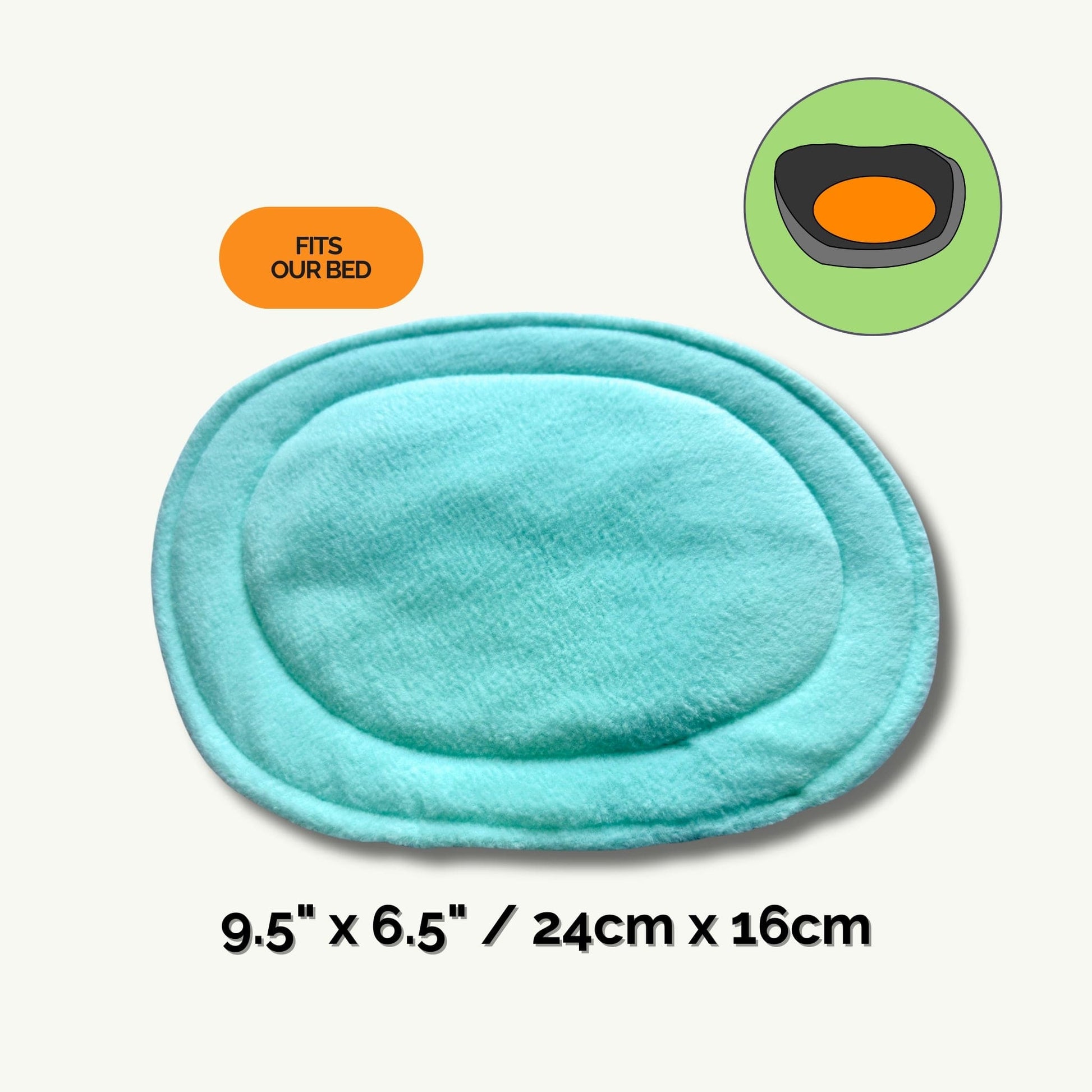 A whimsically gothic light blue pee pad, shaped like a moonlit oval with softly rounded edges, measures 9.5 by 6.5 inches (24 by 16 cm)—the perfect haunt for your small companion’s cozy naps. Above the pad, a charming diagram conjures up its ideal match: our plush coffin-bed, so your little beastie can rest in style. An eye-catching pumpkin-orange label declares, “Fits Our Bed.” Text reads: “Pee Pads | Haunt messes away—make daily clean-up simply bewitching!”.