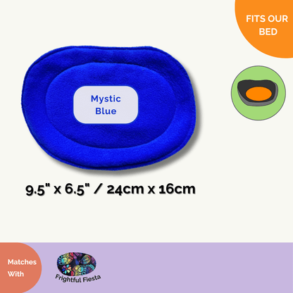 The Frightful Fiesta Matching Pee Pad—a charming oval delight in midnight-mystic blue fleece—measures 9.5 x 6.5 inches (24 x 16 cm). Glamorously haunting yet cozy, it’s displayed atop a ghostly white background with playful icons showing its perfect fit for our gothic-inspired pet bed. Designed especially for your guinea pig or petite creature of the night, it promises easy, spellbinding cleanup and enchanting comfort every day.
