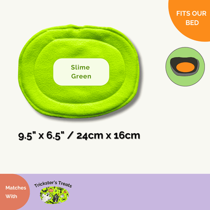 Enchantingly vivid Slime Green oval pet bed (9.5 x 6.5 in), gothic-chic for guinea pigs, pairs with Trickster’s Treats Pee Pads.