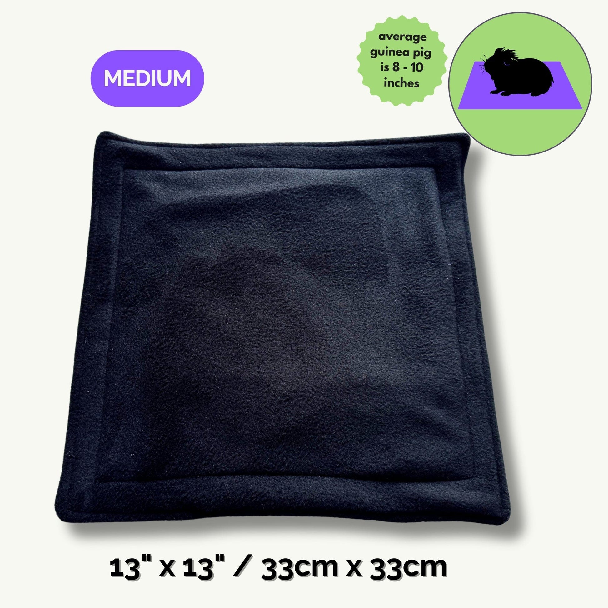 Bewitching black fleece pee pad (medium, 13 x 13 in / 33 x 33 cm) summons a gothic-chic look for your guinea pig’s lair. Soft, midnight fabric cradles little paws, perfectly sized for average piggies (8–10 in long). A cute guinea pig silhouette framed in a mystical moon circle hints at the snug fit and everyday enchantment of hassle-free cleaning.
