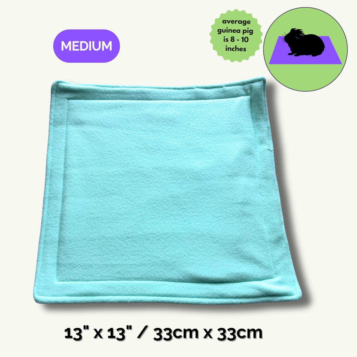 A dreamy, pastel blue pee pad (measuring 13x13 inches / 33x33 cm) rests enchantingly atop a ghostly pale backdrop. Adorned with a whimsical Medium tag and an illustrated guinea pig—charmingly crowned with the note average guinea pig is 8-10 inches—this cozy pad brings gothic-glam flair to your small pet’s lair. Perfect for keeping your familiars’ abodes spellbindingly clean and snuggly, all while turning daily chores into a breeze with a touch of whimsy.