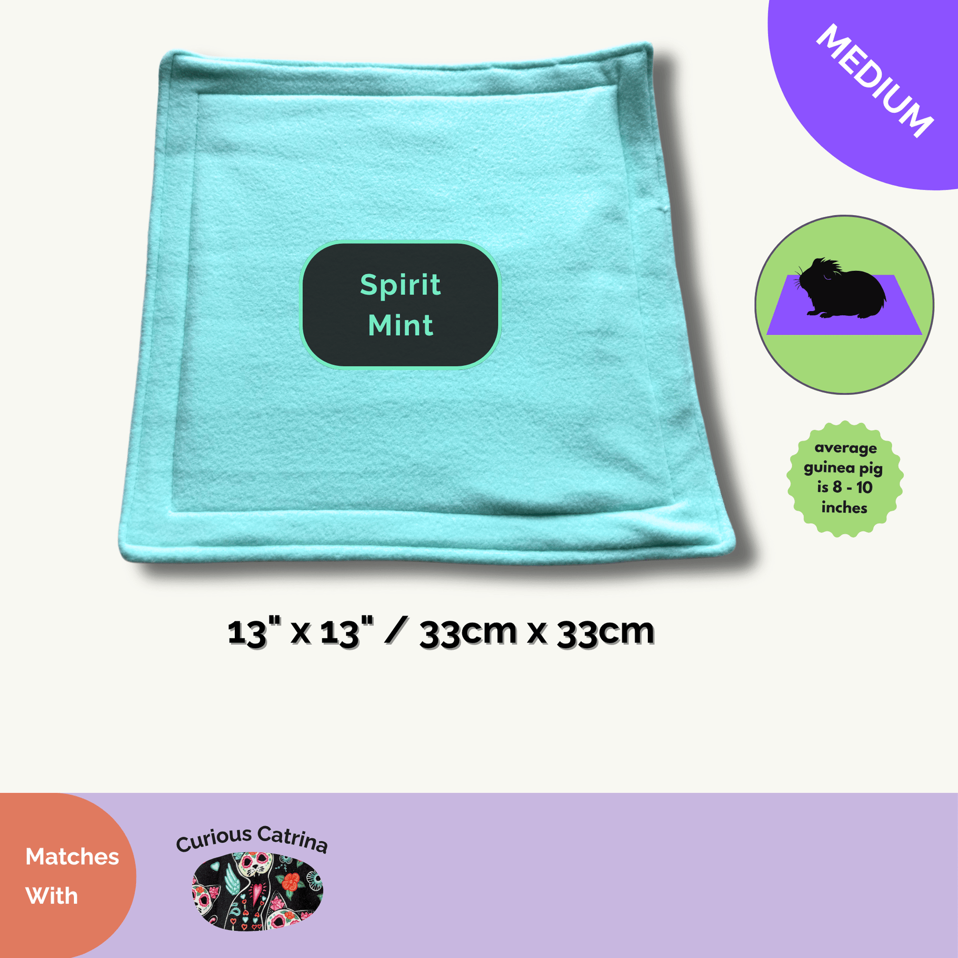 A whimsically gothic, light teal fleece pee pad is pictured—glamorous enough for your small pet’s haunted manor! The pad measures 13 by 13 inches (33cm x 33cm) and is stitched from plush, absorbent fabric, perfect for stylish guinea pigs seeking both comfort and charm. Beside the softly shimmering pad sits a darling label that reads “Curious Catrina Matching Pee Pads,” while coordinating accessories in enchanting prints beckon temptingly below.