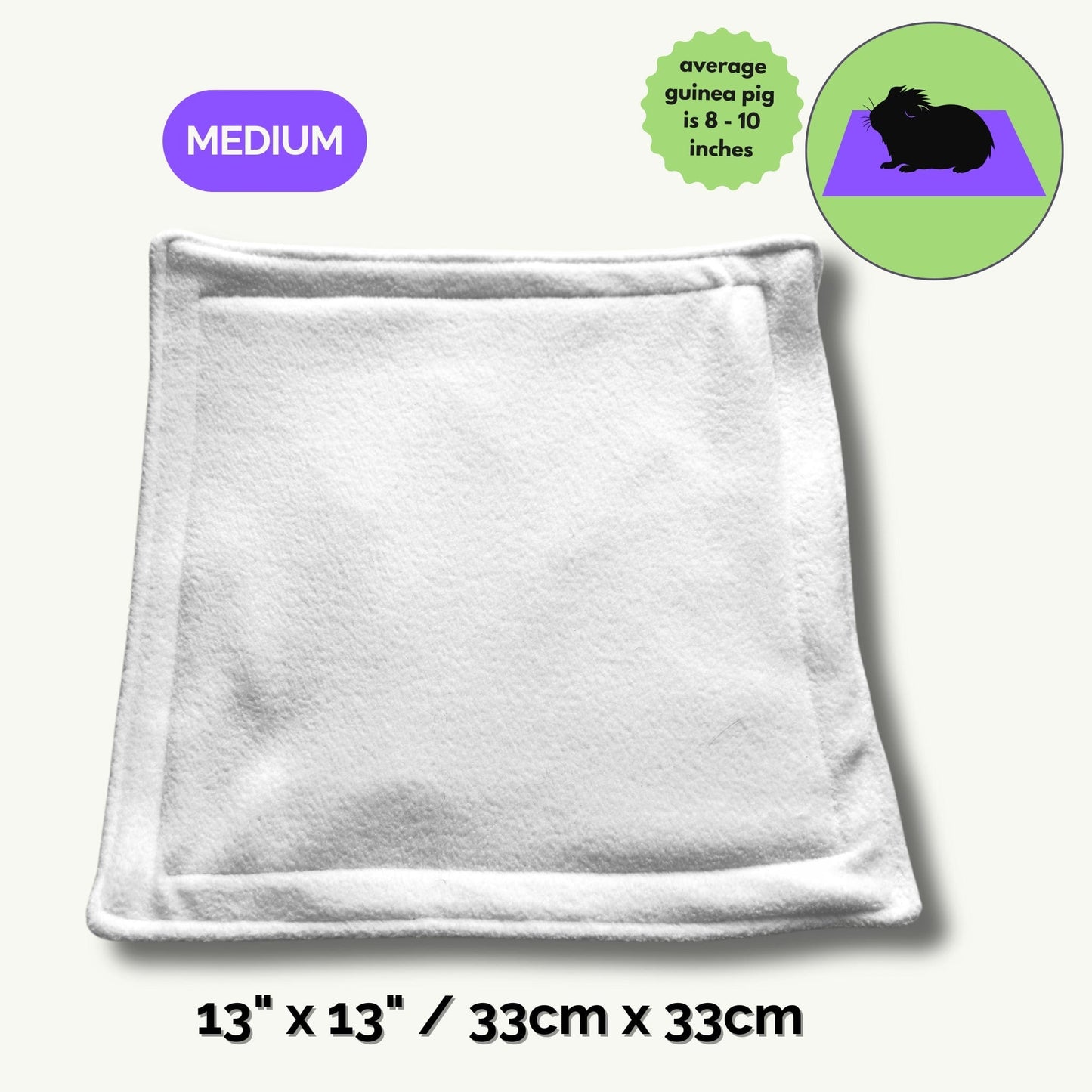 The Pee Pads | Turn daily cleanup into a spellbinding breeze—our ghostly-soft, square fleece pad (13 x 13/33cm x 33cm) summons gothic glam with its crisp white surface, vibrant purple MEDIUM label, and an enchanted green guinea pig illustration. Perfectly sized for your darling familiars (average guinea pigs, 8–10 inches), this pad brings a dash of whimsical charm and moonlit magic to every cozy corner.