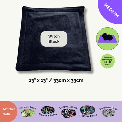 The Trickster’s Treats Pee Pad in Witch Black (13"x13") dazzles with gothic Halloween bedding, “medium” purple badge, and size guide.