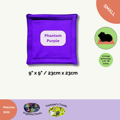 Enchant your guinea pig with this plush, 9"x9" purple fleece pee pad—spooky-cute style for haunt-ready Halloween enclosures!.