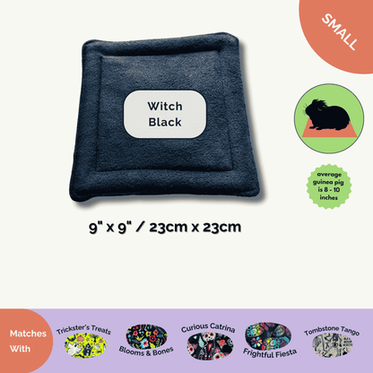 Enchant your guinea pig’s lair with plush black fleece pee pads (9x9in), moonlit by a darling guinea pig print and macabre-chic charm!.