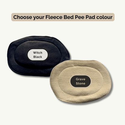 Two oval fleece pee pads—one in bewitching black and one gravestone grey—invite you to choose your color for the Tombstone Tango Set.