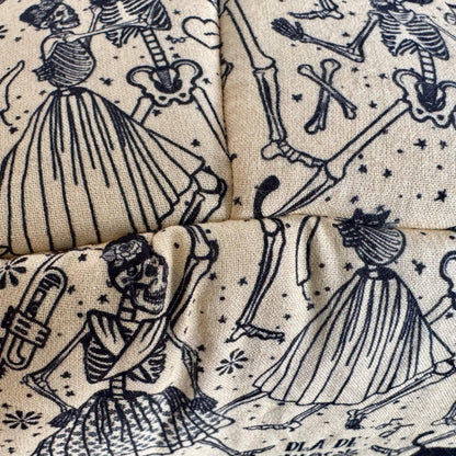 Whimsical black skeletons twirl in frilly dresses, waltzing beneath twinkling stars on creamy, moonlit fleece—Tombstone Tango Fleece Bed wraps your small pet in a gothic-glam embrace. Perfect as a hauntingly cozy, quilted haven for guinea pigs or any tiny familiar seeking snuggly slumber.