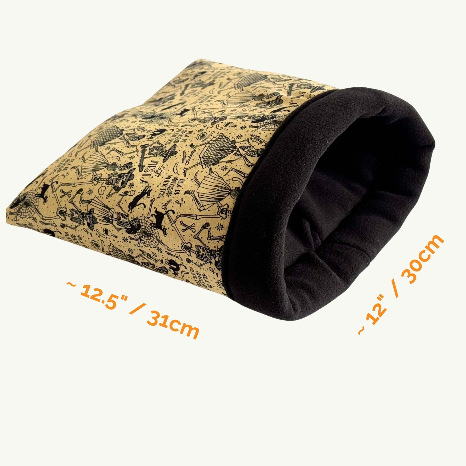 The Tombstone Tango Snuggle Sack is a hauntingly adorable cozy tunnel for small pets, measuring about 12.5 by 12 inches. Crafted from plush tan and midnight black fleece, it features whimsical gothic illustrations of bats, sleepy critters, and tiny tombstones dancing across its surface. The snuggle sack is finished with a soft rolled opening and an ultra-soft fleece lining—offering guinea pigs or other small familiars a plush hideaway straight out of a gothic fairytale.