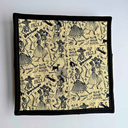 Ghoul-chic snuffle mat with lively skeletons and guitars on beige, framed in black—spooky-fun for small pets’ treat hunts!.