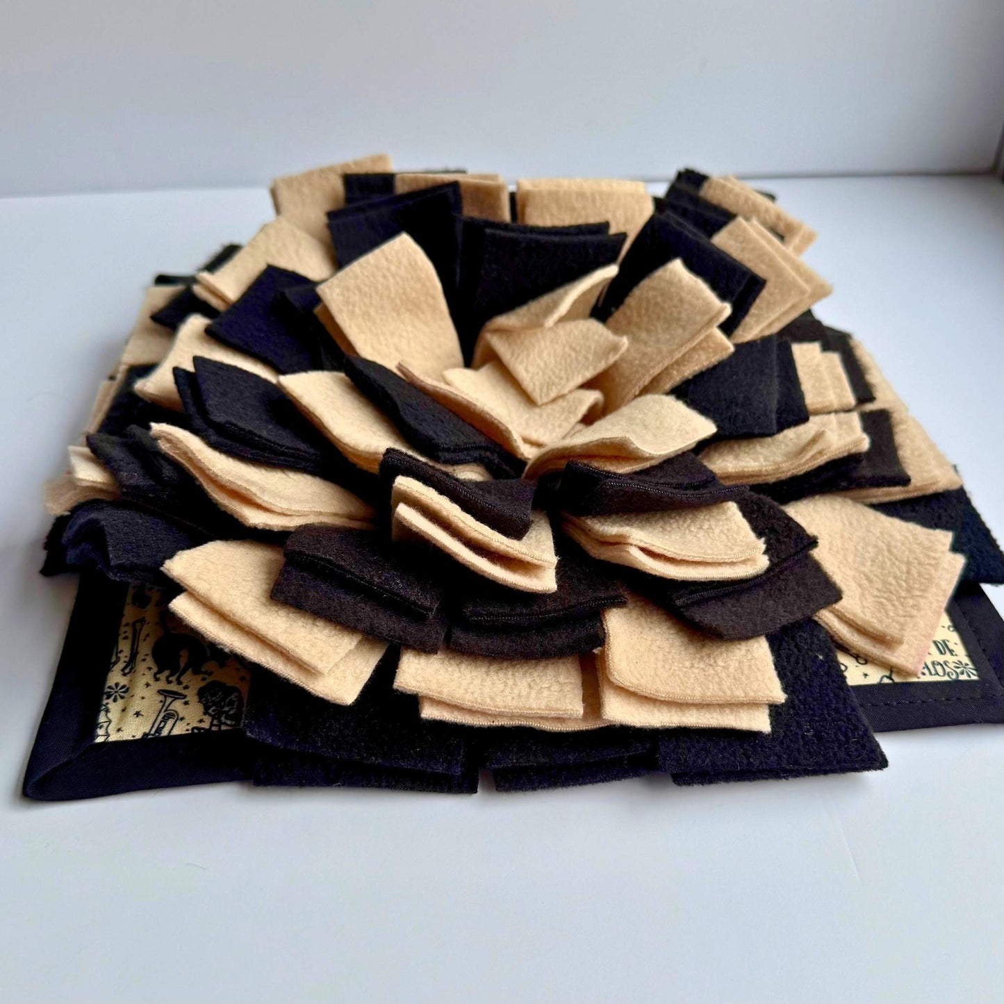 The Tombstone Tango Snuffle Mat blooms with gothic petals of dusky black and bone beige—every nibble a spooky-cute delight.