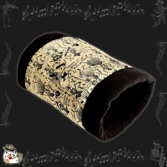 The Tombstone Tango Fleece Tunnel enchants with its gothic-glam flair, cloaked in midnight black and moonlit cream. Lively Día de los Muertos skeletons dance and play instruments, serenading your guinea pig with whimsical music notes swirling through the soft fleece. In the bottom left corner, a charming little cartoon skull donning a dapper hat adds a mischievous touch to this cozy crypt of comfort—ideal for small pets who love to snooze in spooky-cute style.