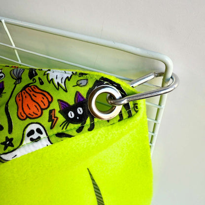 A whimsical peek at Trickster’s Treats Corner Fleece Forest—a cozy yellow hideaway trimmed in spooky-cute green with glam Halloween prints.