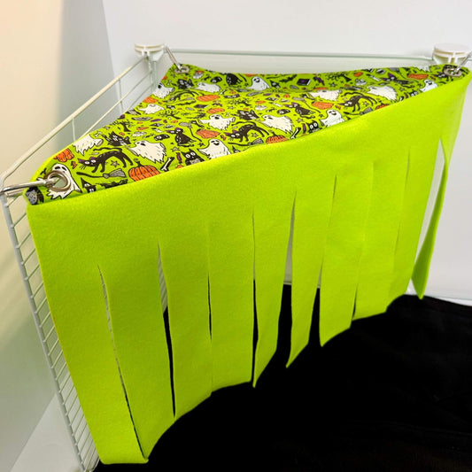 Enchant your piggies’ cage corner with lush green fleece, a ghostly guinea pig fringe, and whimsically spooky Halloween prints!.
