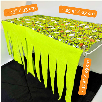 Enchant your piggies with this gothic-glam fleece hideout, draped in Halloween prints and sunlit yellow curtains; 13"x25.5"x11.5".