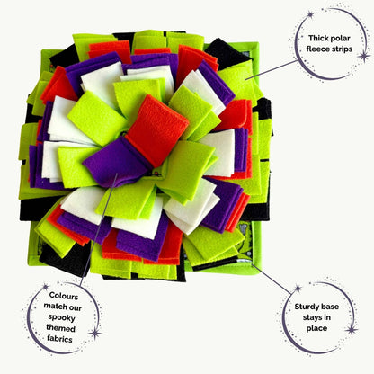 Haunt your hutch with The Trickster’s Treats Snuffle Mat—gothic green, orange, purple, white, and black fleece strips await secret snacks.