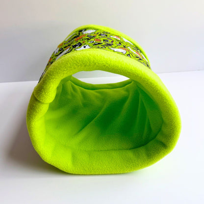 The Trickster's Treats Fleece Tunnel glows neon slime-green with witchy trim—perfect for midnight zoomies and spectral snuggles.